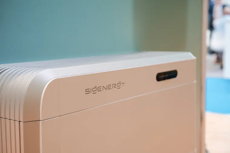 A battery unit displayed against the stand wall.