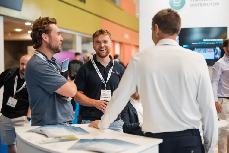 Guests speak with the team beside the counter.
