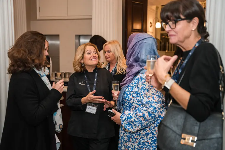 Attendees meeting during the reception.