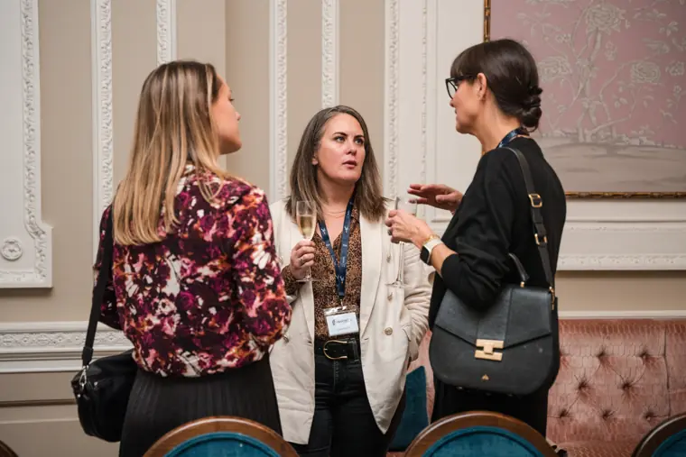 Guests in conversation during the arrival reception.