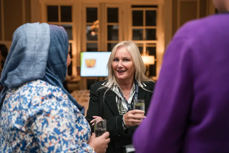 Guests chatting in the reception area.