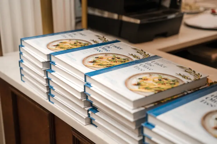 Recipe books displayed beside the dining room.