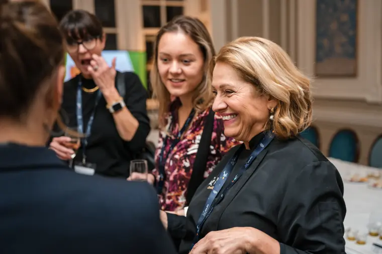 Conversation between attendees before the programme.