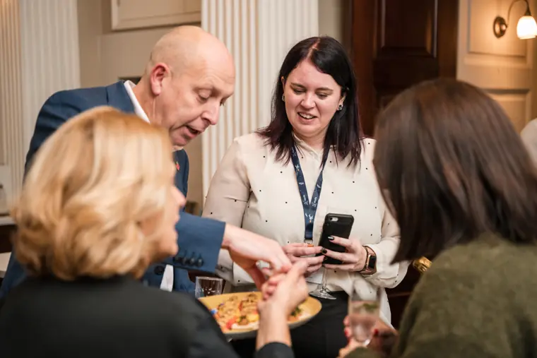 Guests sharing a drink at the networking reception.