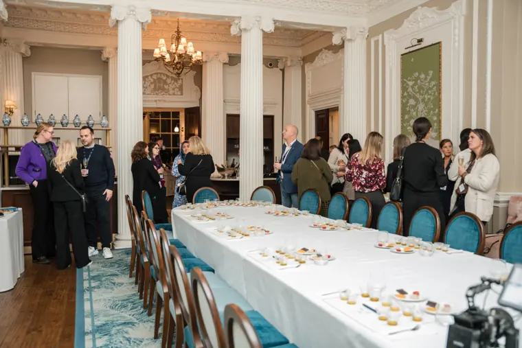 Wide view of the reception around the long table.