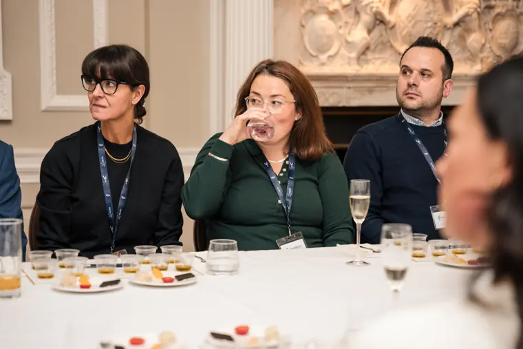 Guests listening during the tasting presentation.