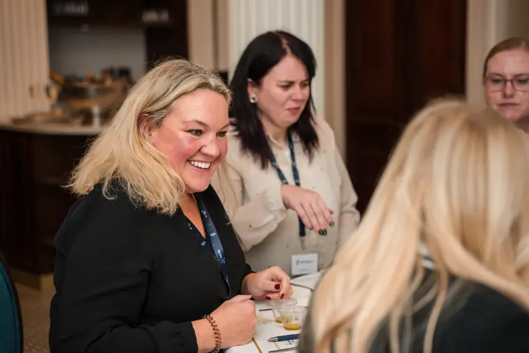 Attendees smiling during the interactive session.