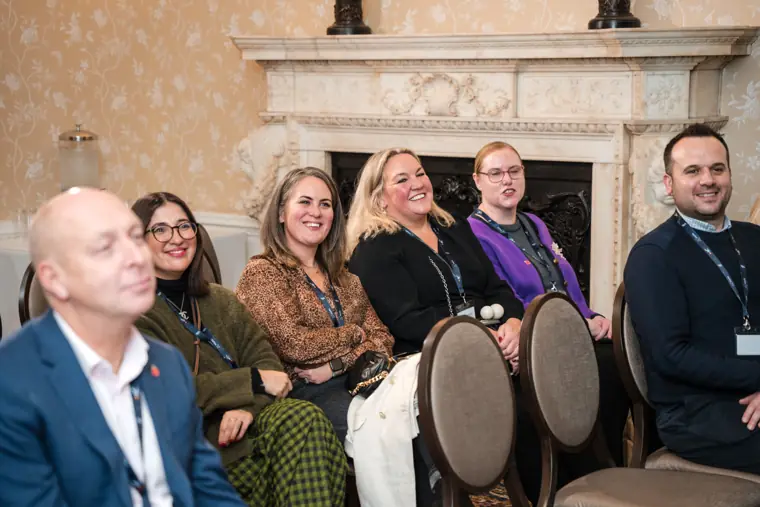 Attendees reacting to a panel discussion.