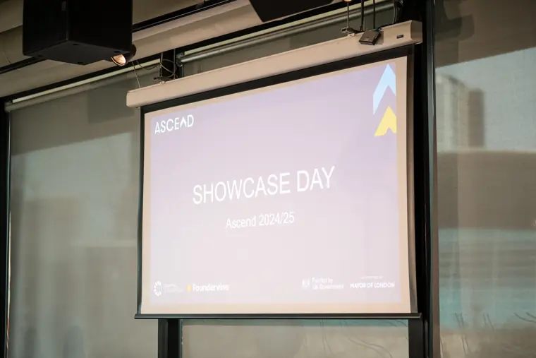 The Ascend Showcase Day title appears on the presentation screen.