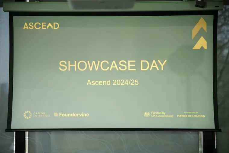 The Ascend Showcase Day slide on the venue screen.