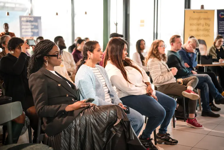 The audience watches the showcase programme.