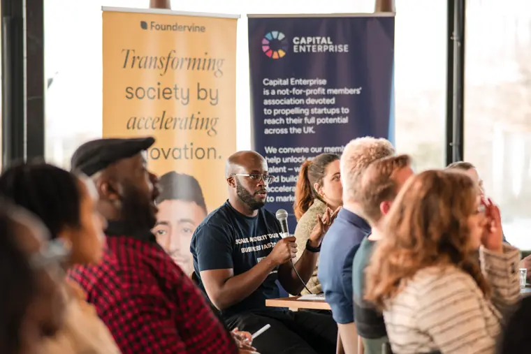 A judge asks a question during a founder pitch.