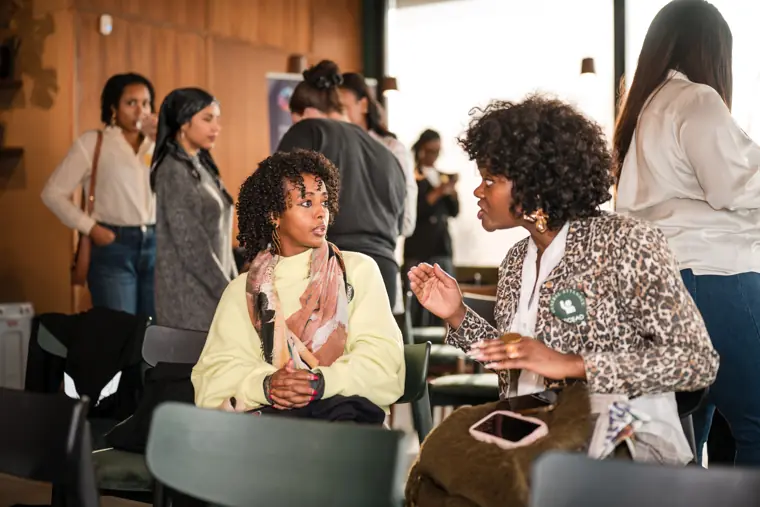A group of attendees connects during networking.