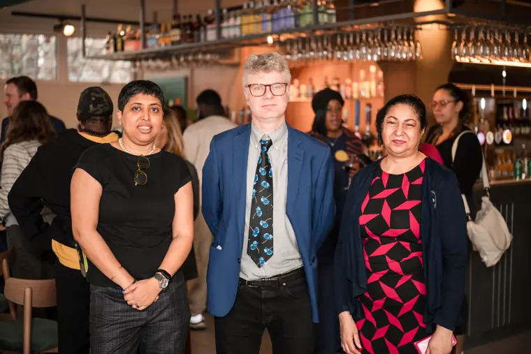 Four participants pose together during the reception.