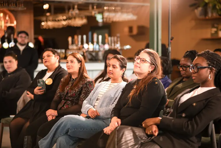 Audience members listen during the closing session.