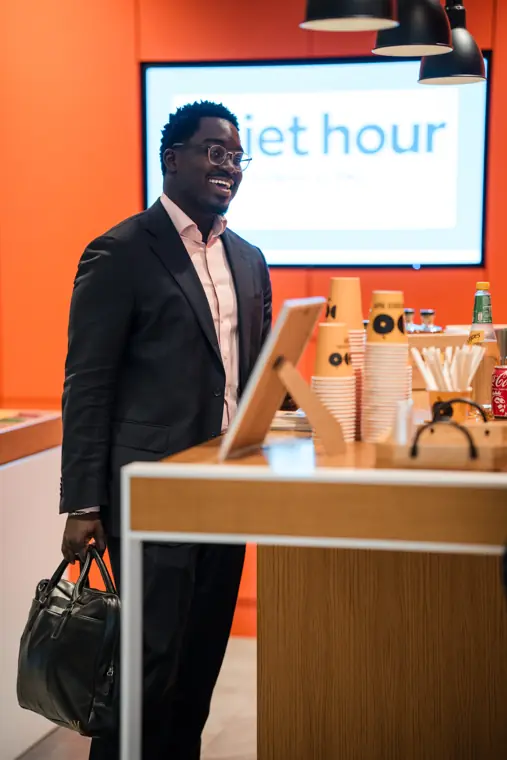 An attendee arrives in the reception area.