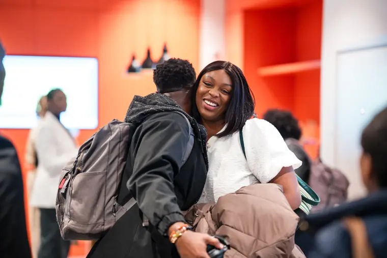 Friends greet each other before the programme.