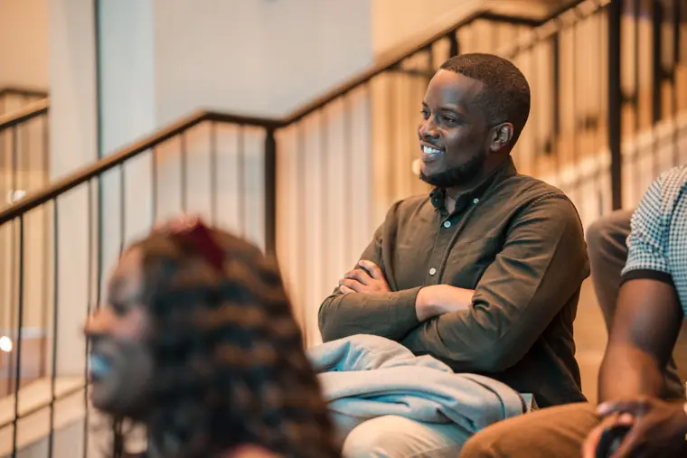 An attendee listens to the opening session.