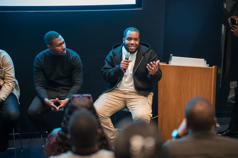 A panelist speaks to the room.