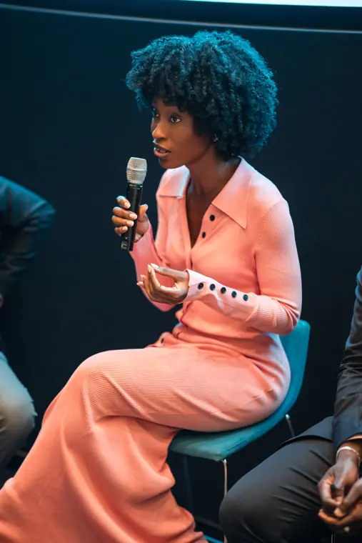 A panelist responds during the conversation.