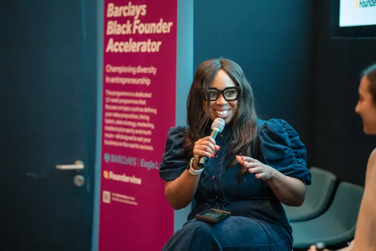 A speaker addresses the panel and audience.