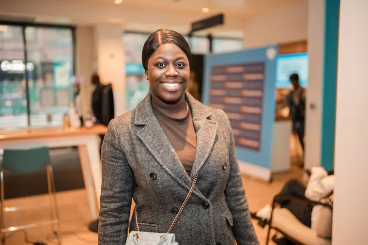 A founder smiles in the reception space.