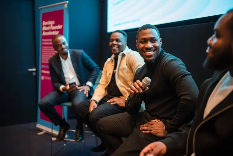 A panelist smiles during the discussion.