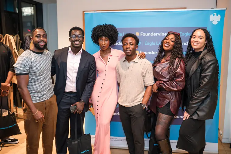 Panelists and organisers pose together.