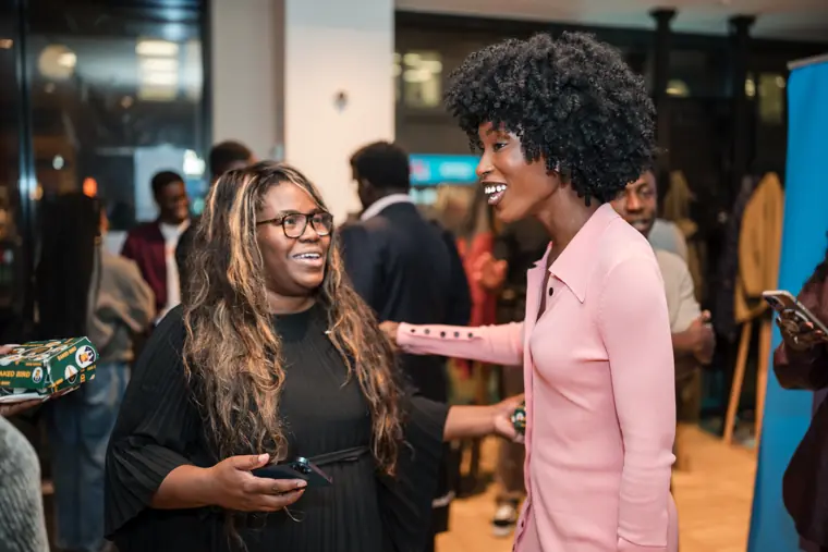 A guest meets a founder at the reception.