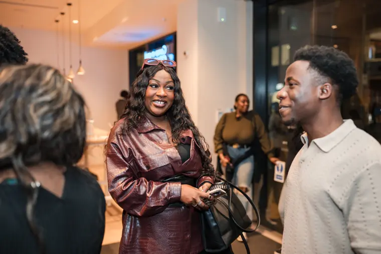 A founder catches up with another attendee.