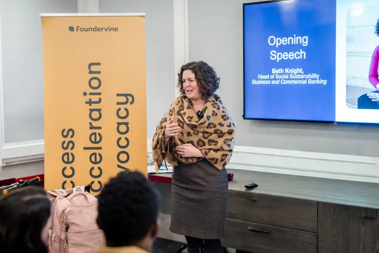 A speaker shares the programme with the room.