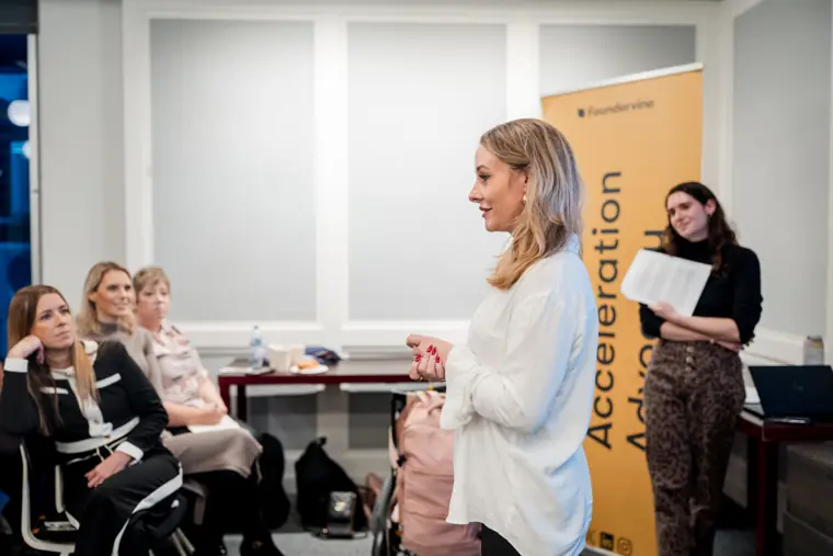 A speaker shares the programme with the room.