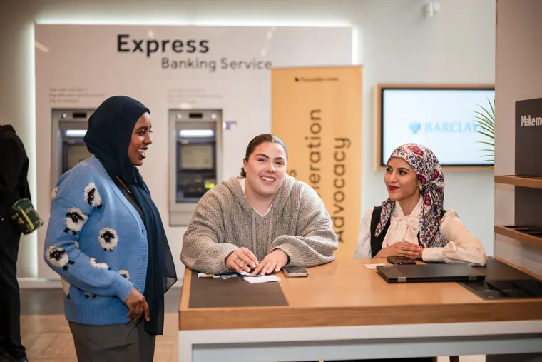 Guests check in at the reception desk.