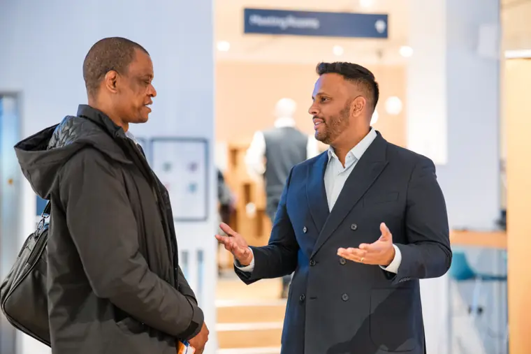 Two guests connect during networking.