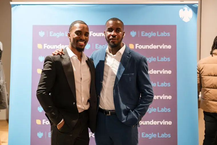 Two founders pose together at Demo Day.