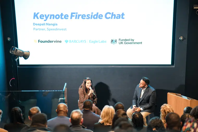A fireside conversation on stage.