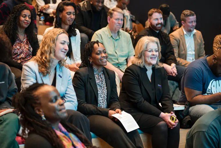 Guests react during the stage conversation.