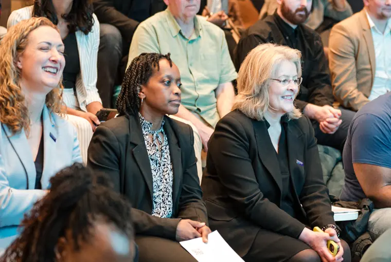 Attendees listen closely to the speakers.
