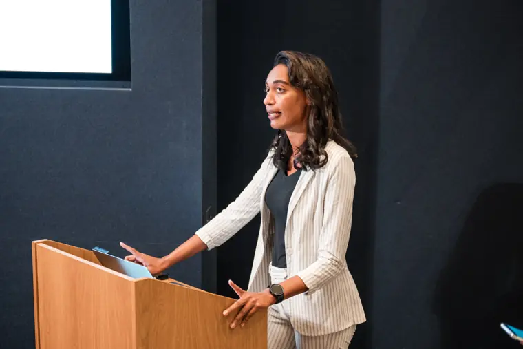 A founder speaks from behind the lectern.