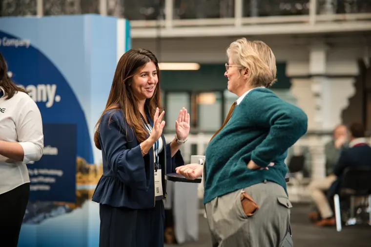 Attendees exchanging ideas at the event.