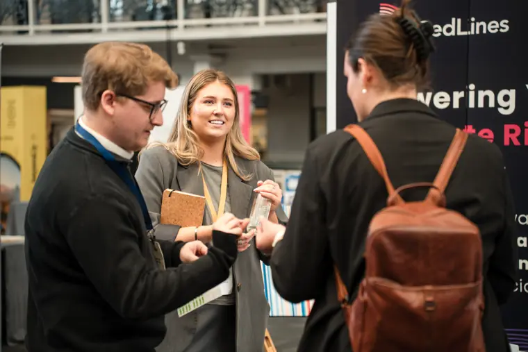 Delegates networking near the Foundervine stand.