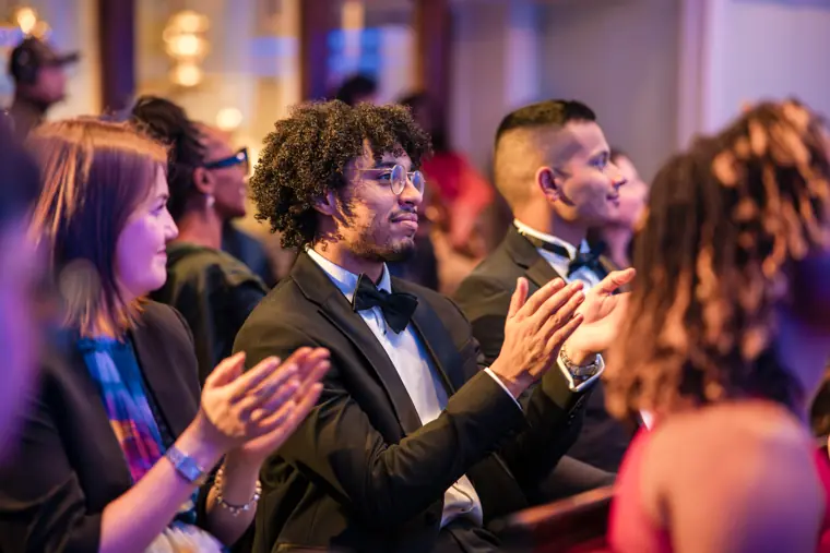 An audience member smiles during the programme.