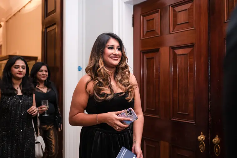 An attendee arrives at the reception.