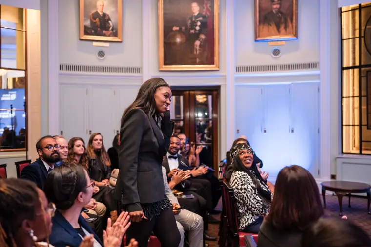 Guests applaud an award announcement.