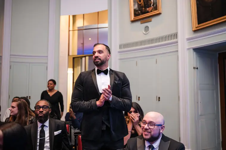 A guest speaks from among the audience.