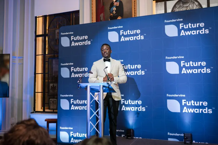 Two presenters share an award moment.