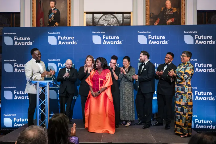 Foundervine organisers and guests celebrate on stage.