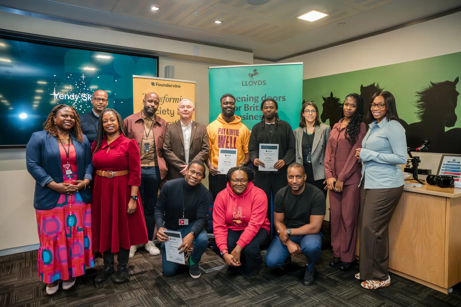 The showcase cohort poses together at the end of the event.
