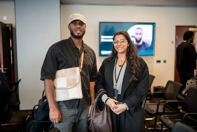 Two participants pose together after the showcase.