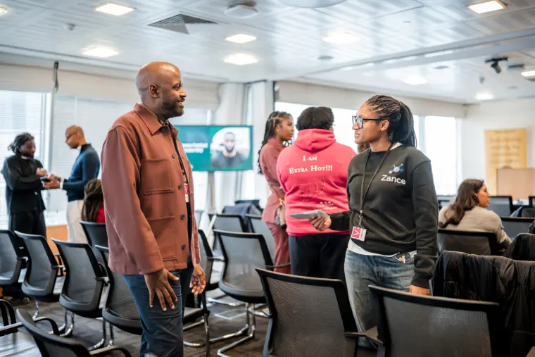 Guests continue a conversation among the showcase seating.